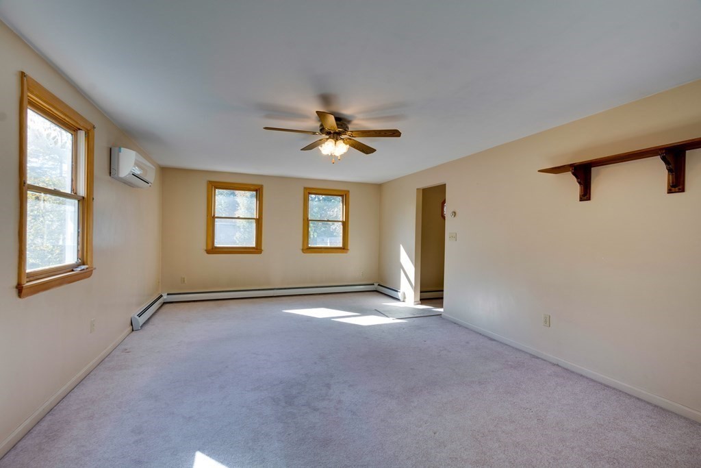 23 Fairmeadow Road Wilmington, MA 01887 - Photo 21 of 24 a view of a livingroom with a ceiling fan and window
