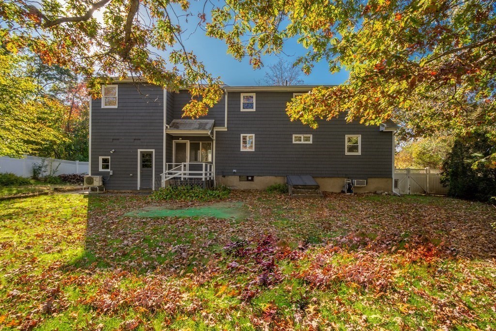 23 Fairmeadow Road Wilmington, MA 01887 - Photo 23 of 24 front view of a house with a yard