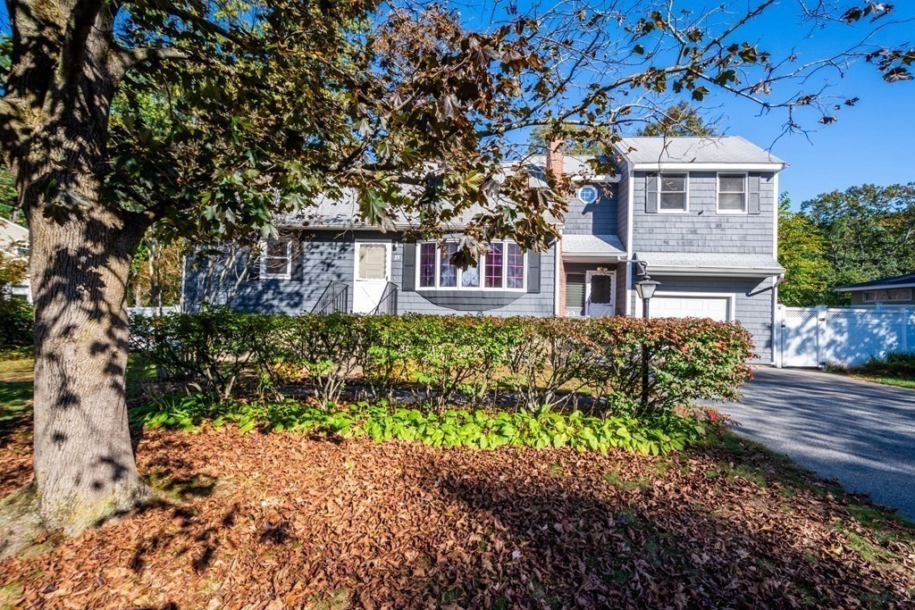 23 Fairmeadow Road Wilmington, MA 01887 - Photo 24 of 24 a front view of a house with a yard