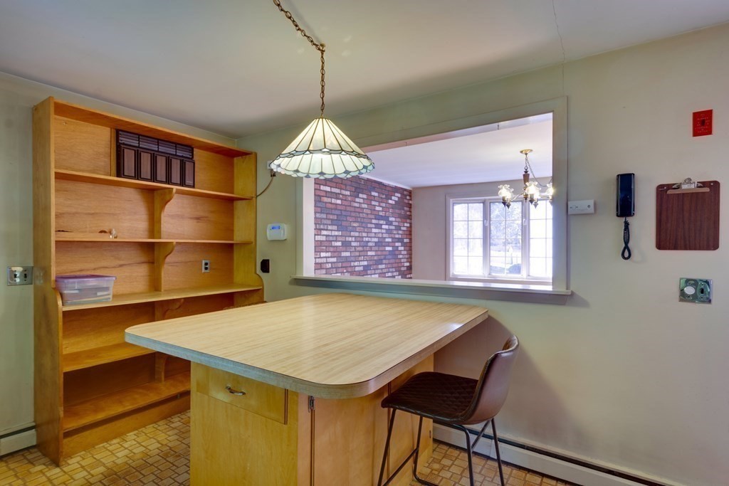 23 Fairmeadow Road Wilmington, MA 01887 - Photo 4 of 24 a view of a dining room with furniture and a chandelier