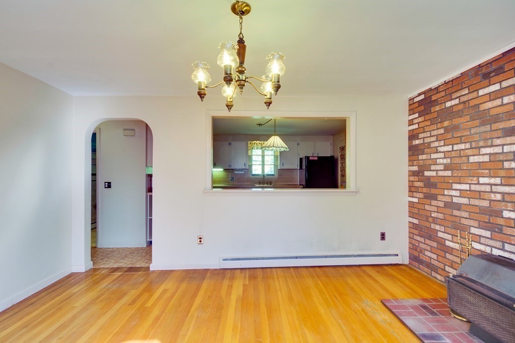 23 Fairmeadow Road Wilmington, MA 01887 - Photo 7 of 24 a view of a living room with a large window