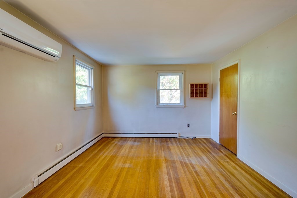 23 Fairmeadow Road Wilmington, MA 01887 - Photo 9 of 24 a view of a room with wooden floor and window