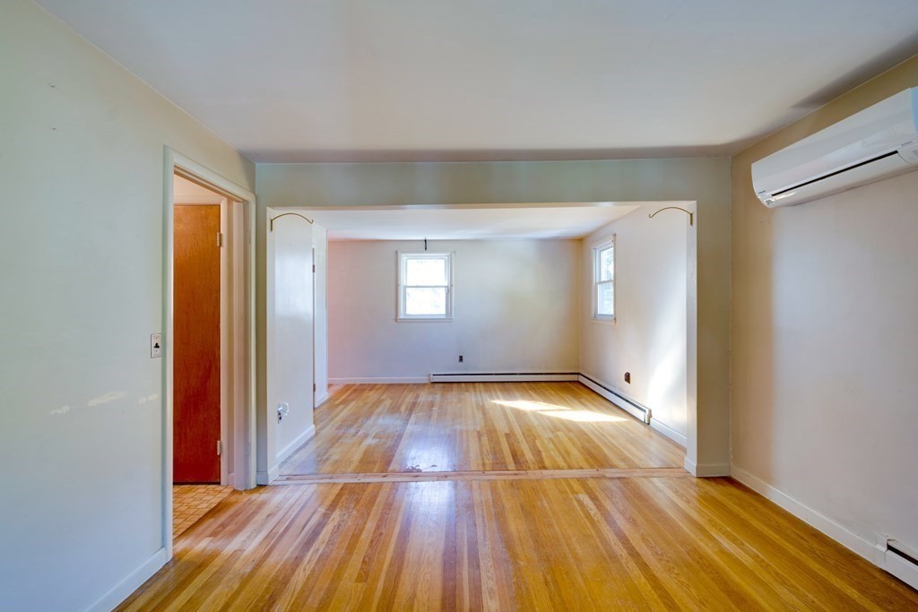 23 Fairmeadow Road Wilmington, MA 01887 - Photo 10 of 24 a view of a room with wooden floor and window