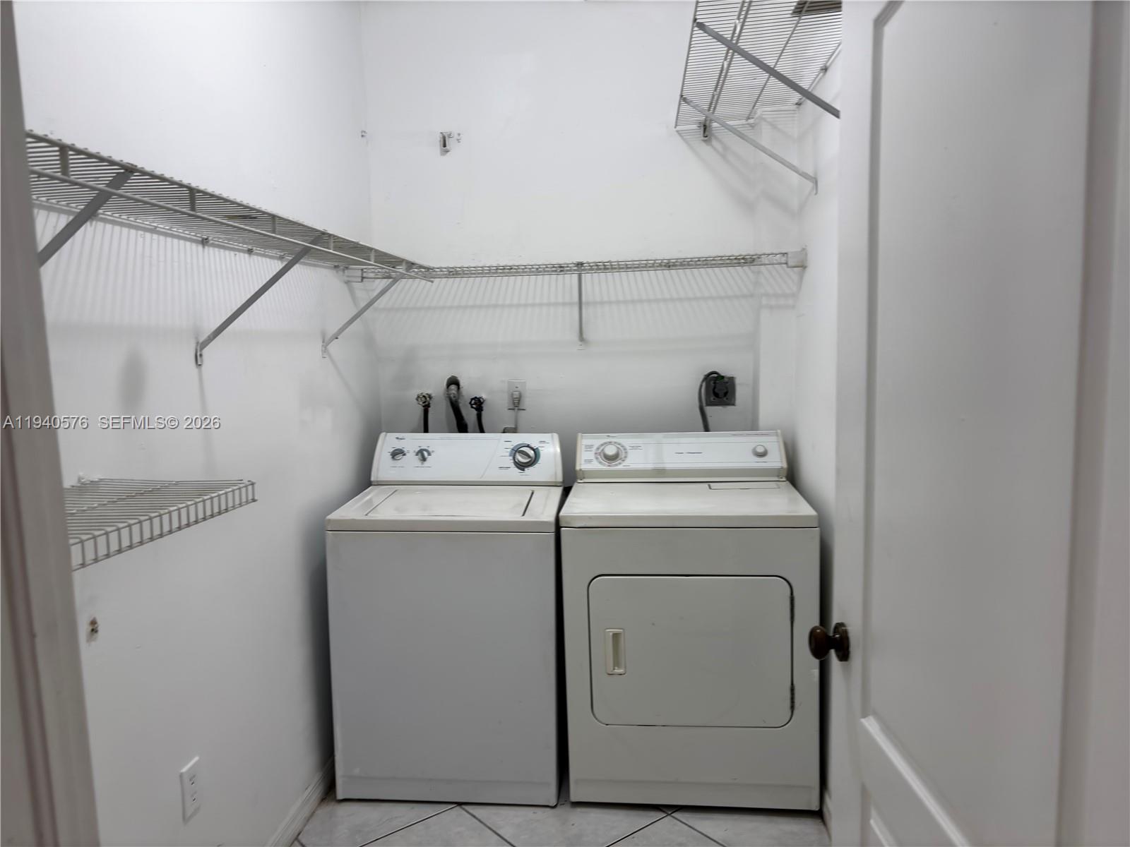 12645 Southwest 91st Street, Unit 2014 Miami, FL 33186 - Photo 12 of 15 a utility room with dryer and washer