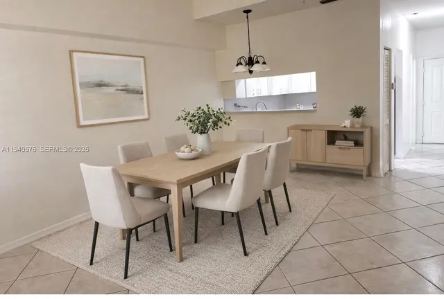 a dining room with furniture and window