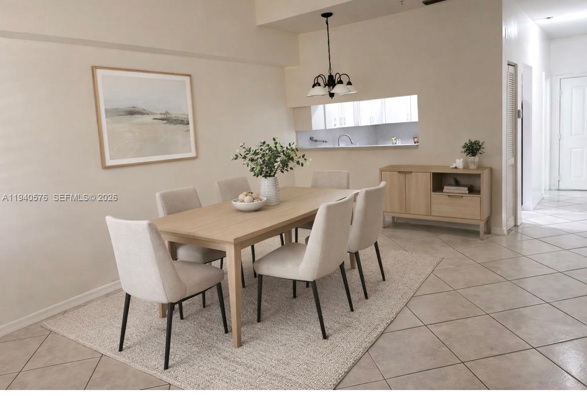 12645 Southwest 91st Street, Unit 2014 Miami, FL 33186 - Photo 2 of 15 a dining room with furniture and window