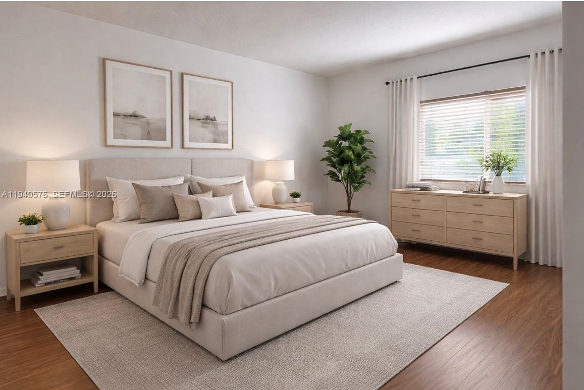 12645 Southwest 91st Street, Unit 2014 Miami, FL 33186 - Photo 8 of 15 a bedroom with a large bed and a window