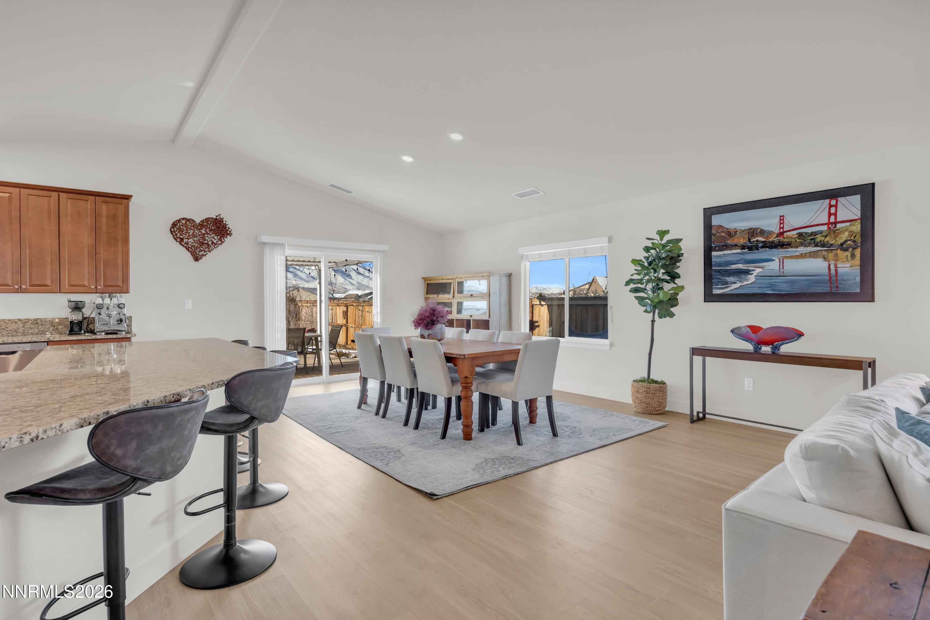 7445 Hundred Acre Drive Reno, NV 89506 - Photo 11 of 41 a living room with furniture and a dining table with projector