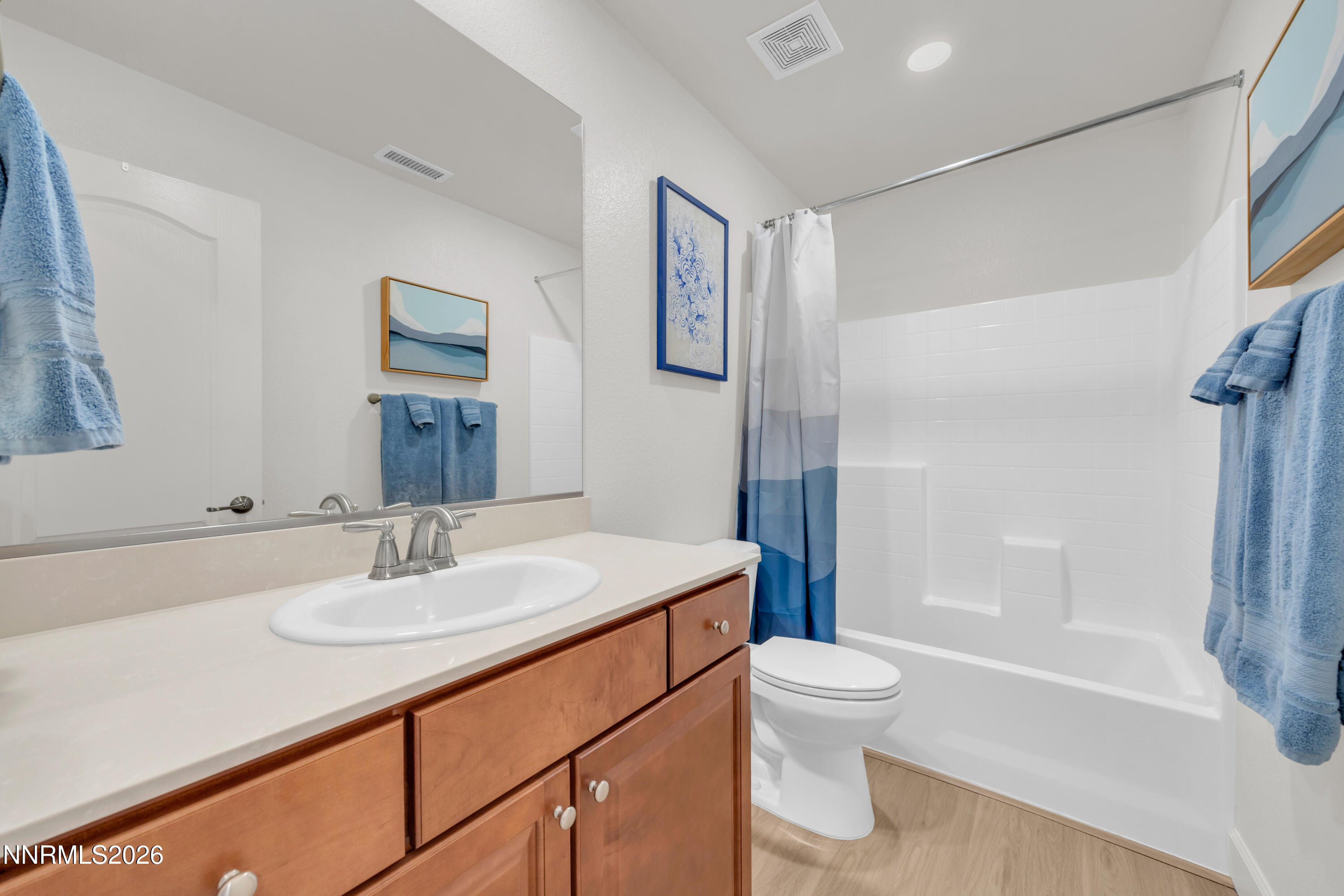 7445 Hundred Acre Drive Reno, NV 89506 - Photo 19 of 41 a bathroom with a sink a toilet and shower