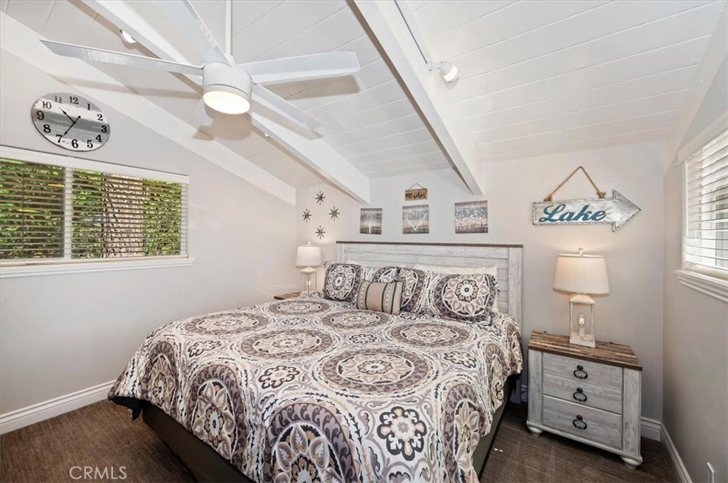 27550 North Bay Road Lake Arrowhead, CA 92352 - Photo 22 of 32 a bedroom with a bed and a window