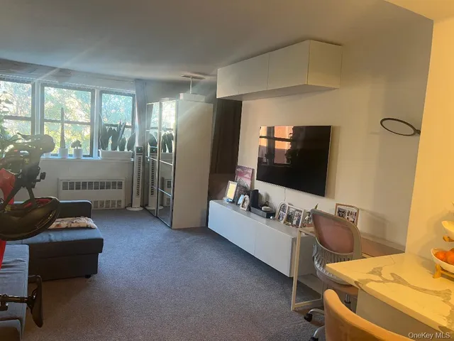 a living room with furniture and flowers