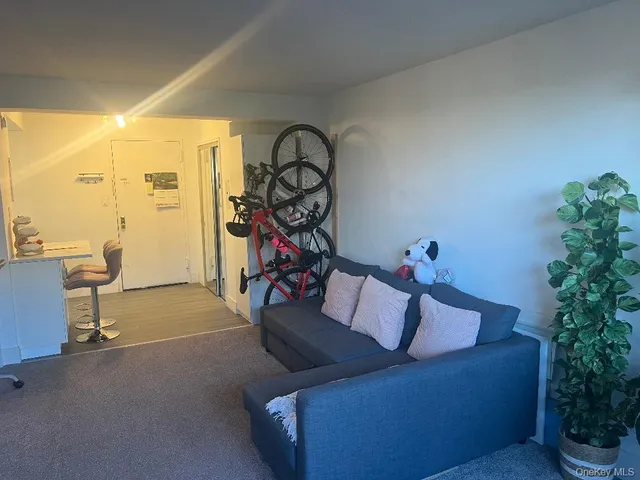 a view of a livingroom with furniture and a flat screen tv