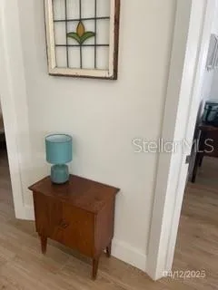 a view of kitchen with cabinets and wooden floor