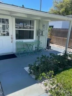 a view of a dining room with furniture and window