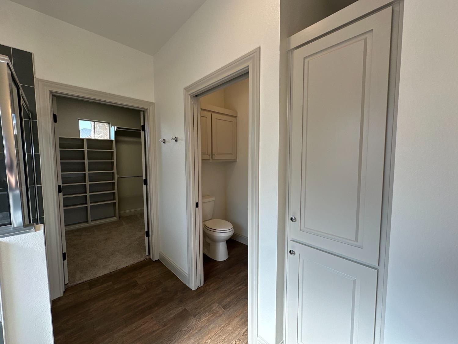 6959 103rd Street Lubbock, TX 79424 - Photo 16 of 49 wooden floor with closet and mirror