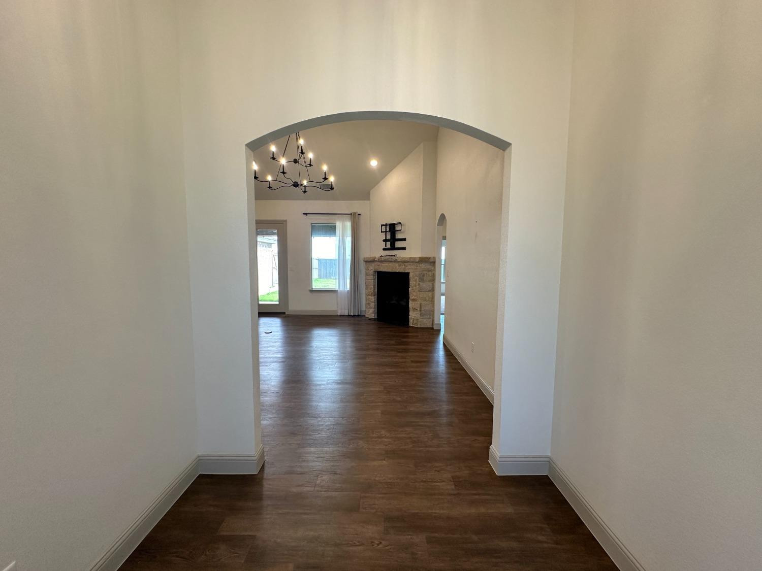 6959 103rd Street Lubbock, TX 79424 - Photo 2 of 49 a view of a livingroom with wooden floor