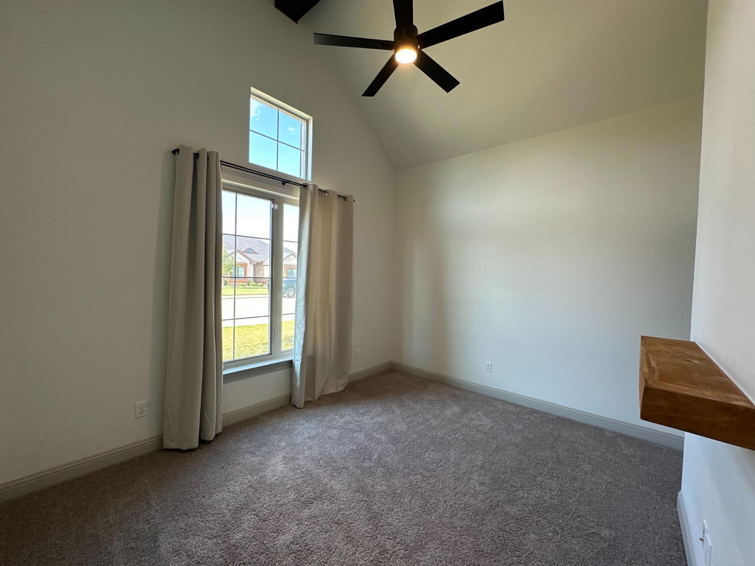 6959 103rd Street Lubbock, TX 79424 - Photo 26 of 49 an empty room with windows and cabinet