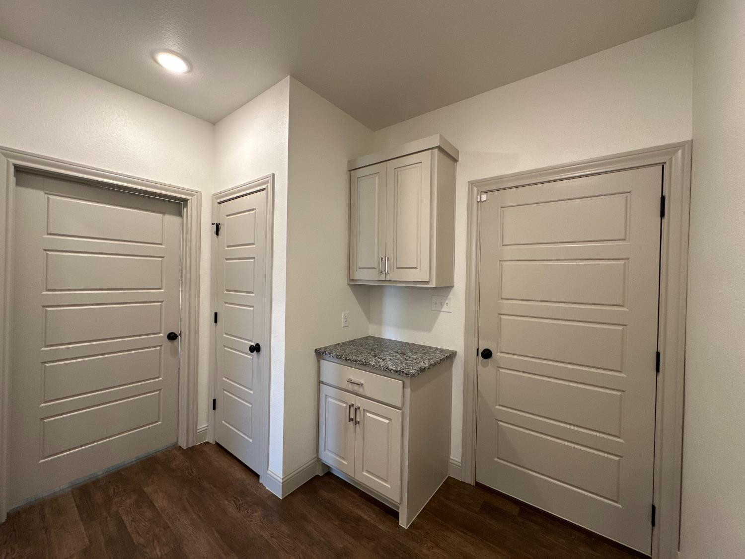 6959 103rd Street Lubbock, TX 79424 - Photo 28 of 49 a view of cabinets and wooden floor