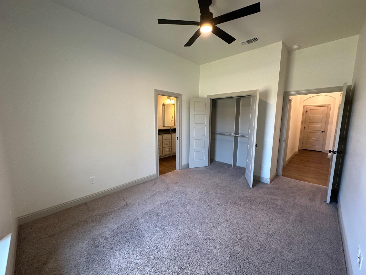 6959 103rd Street Lubbock, TX 79424 - Photo 33 of 49 an empty room with closet and a bathroom