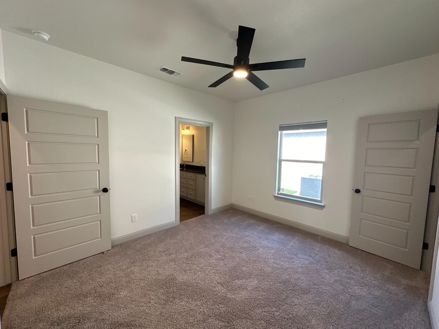 6959 103rd Street Lubbock, TX 79424 - Photo 41 of 49 an empty room with windows and closet area