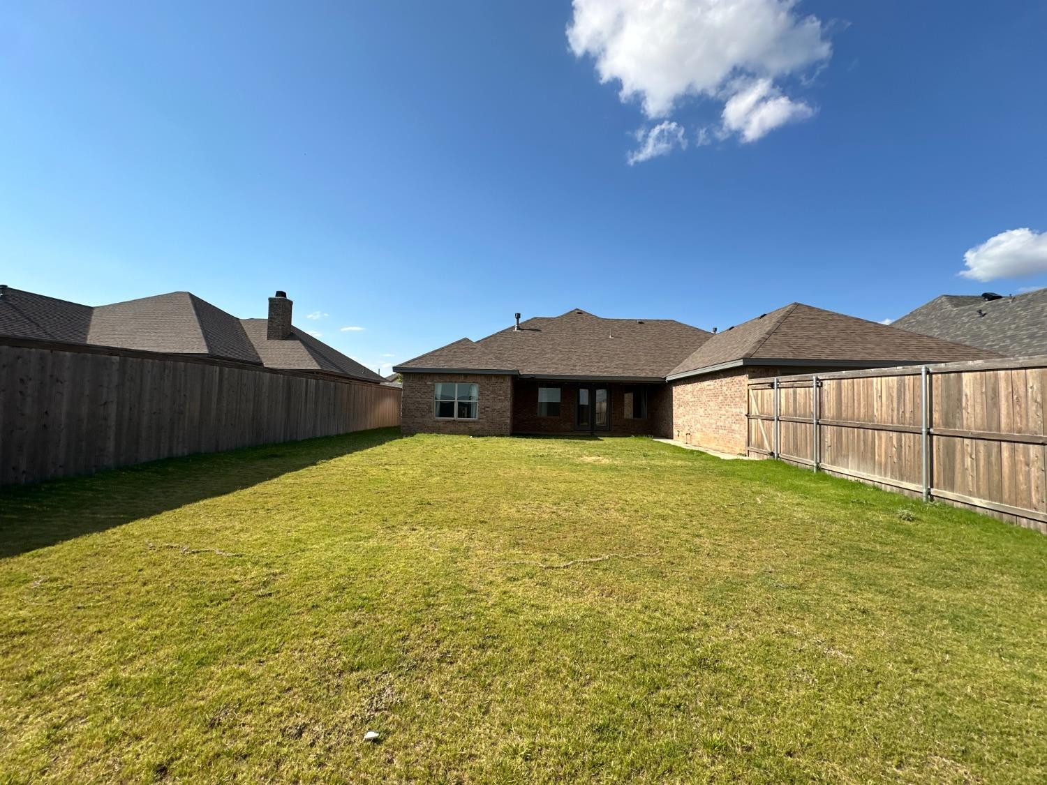 6959 103rd Street Lubbock, TX 79424 - Photo 46 of 49 a view of a house with a yard