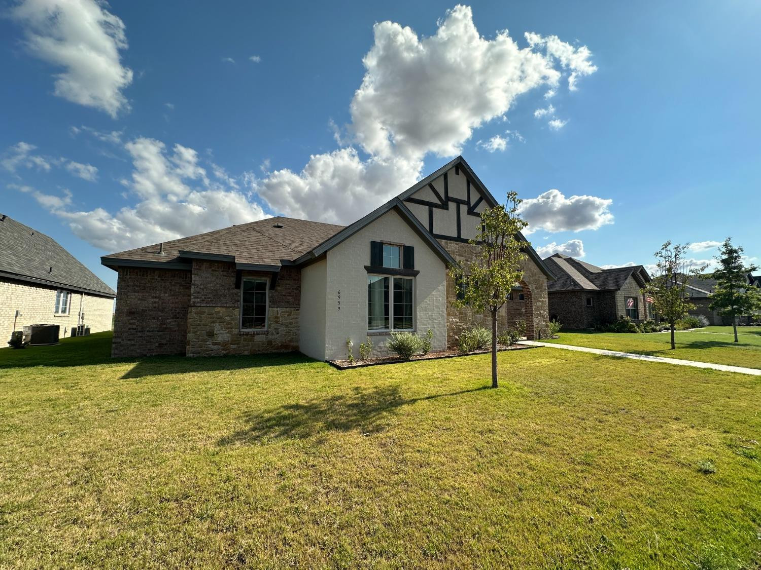 6959 103rd Street Lubbock, TX 79424 - Photo 48 of 49 a view of a house with a yard