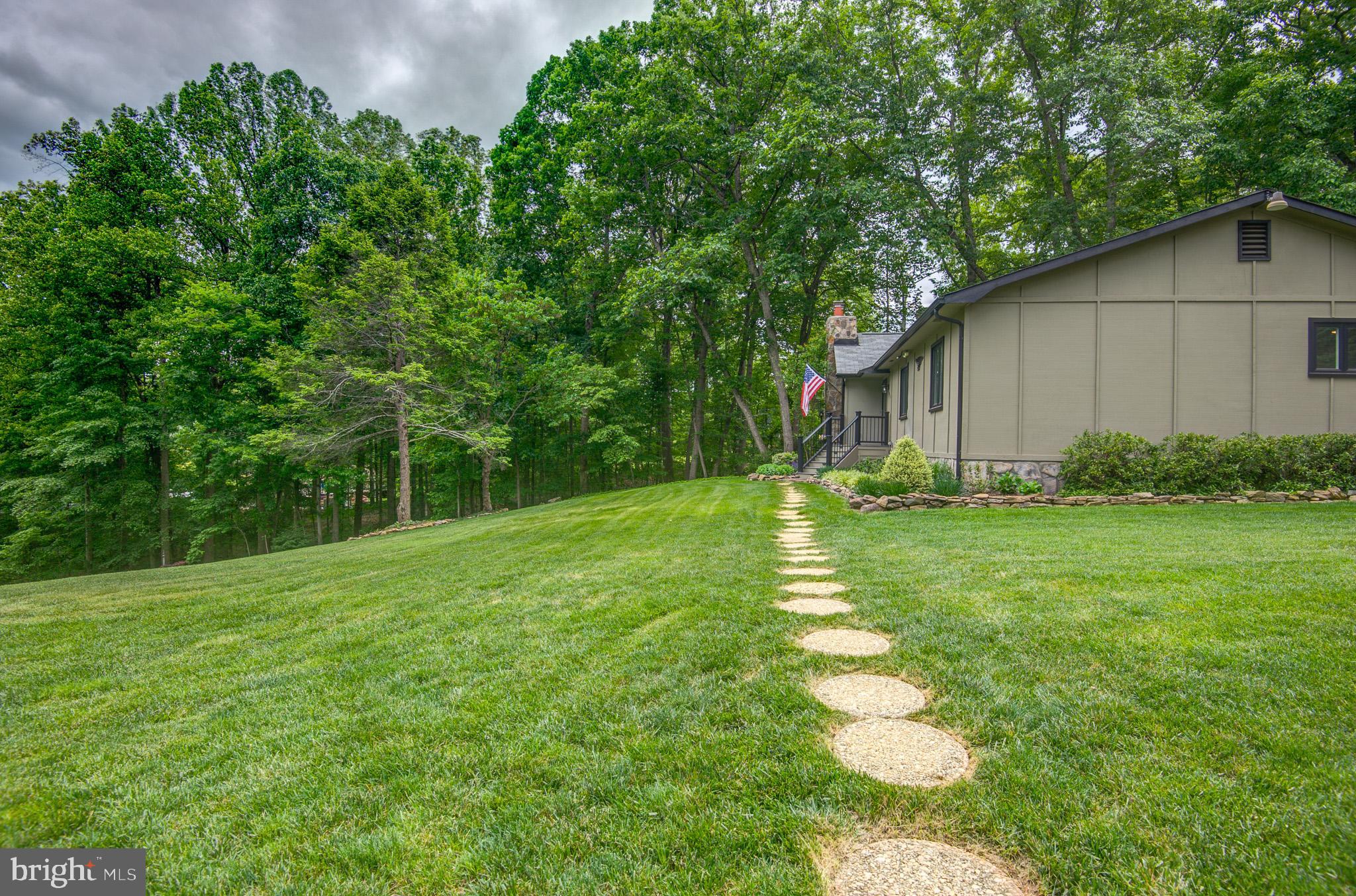10116 Evans Ford Road Manassas, VA 20111 - Photo 55 of 63 a backyard of a house with lots of green space