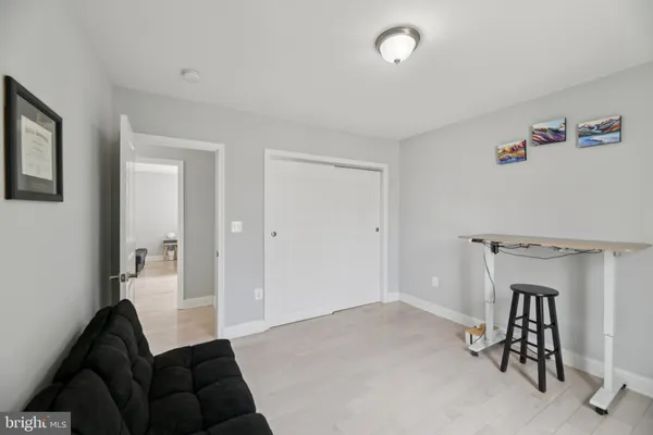a bathroom with a glass door shower