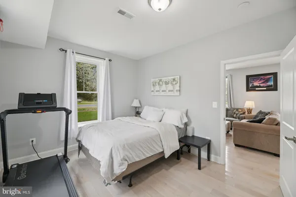 a view of a porch with furniture and garden