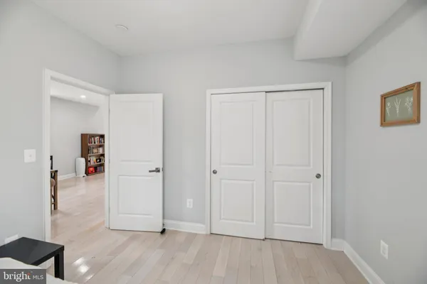 a view of a house with a patio and a yard