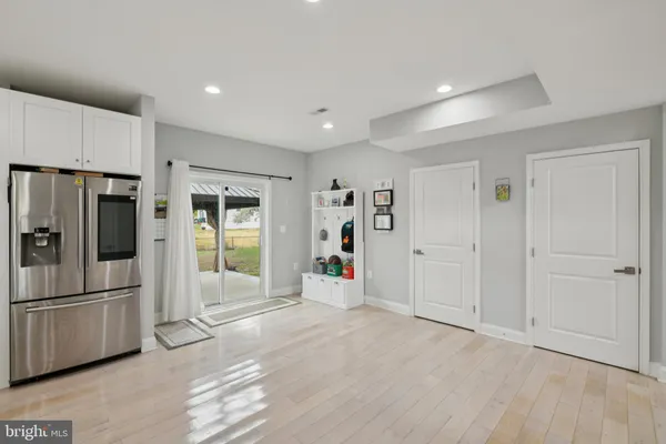 a view of a livingroom with furniture and staircase