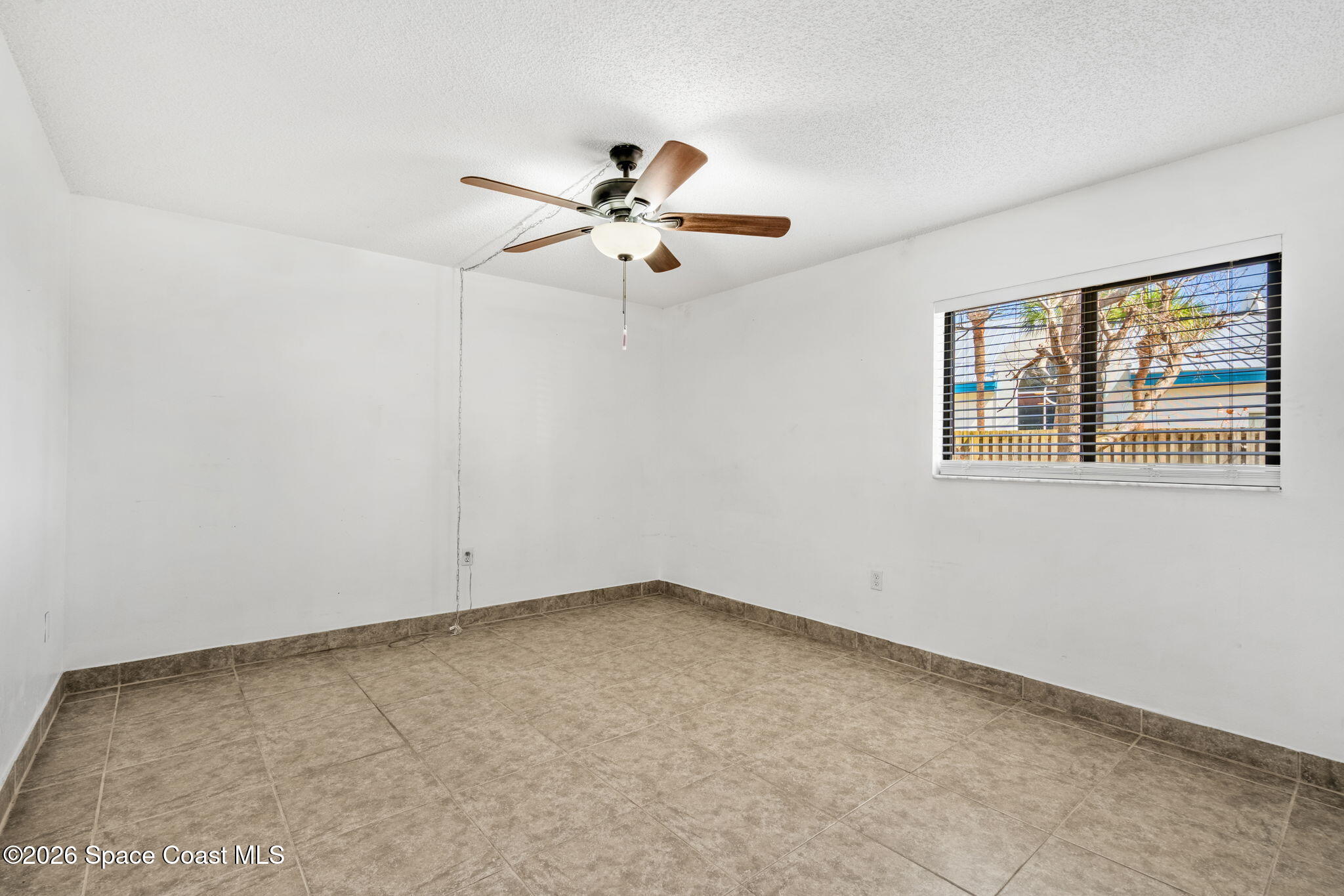 500 Catalina Road, Unit 402 Cocoa Beach, FL 32931 - Photo 13 of 34 a view of an empty room with a window
