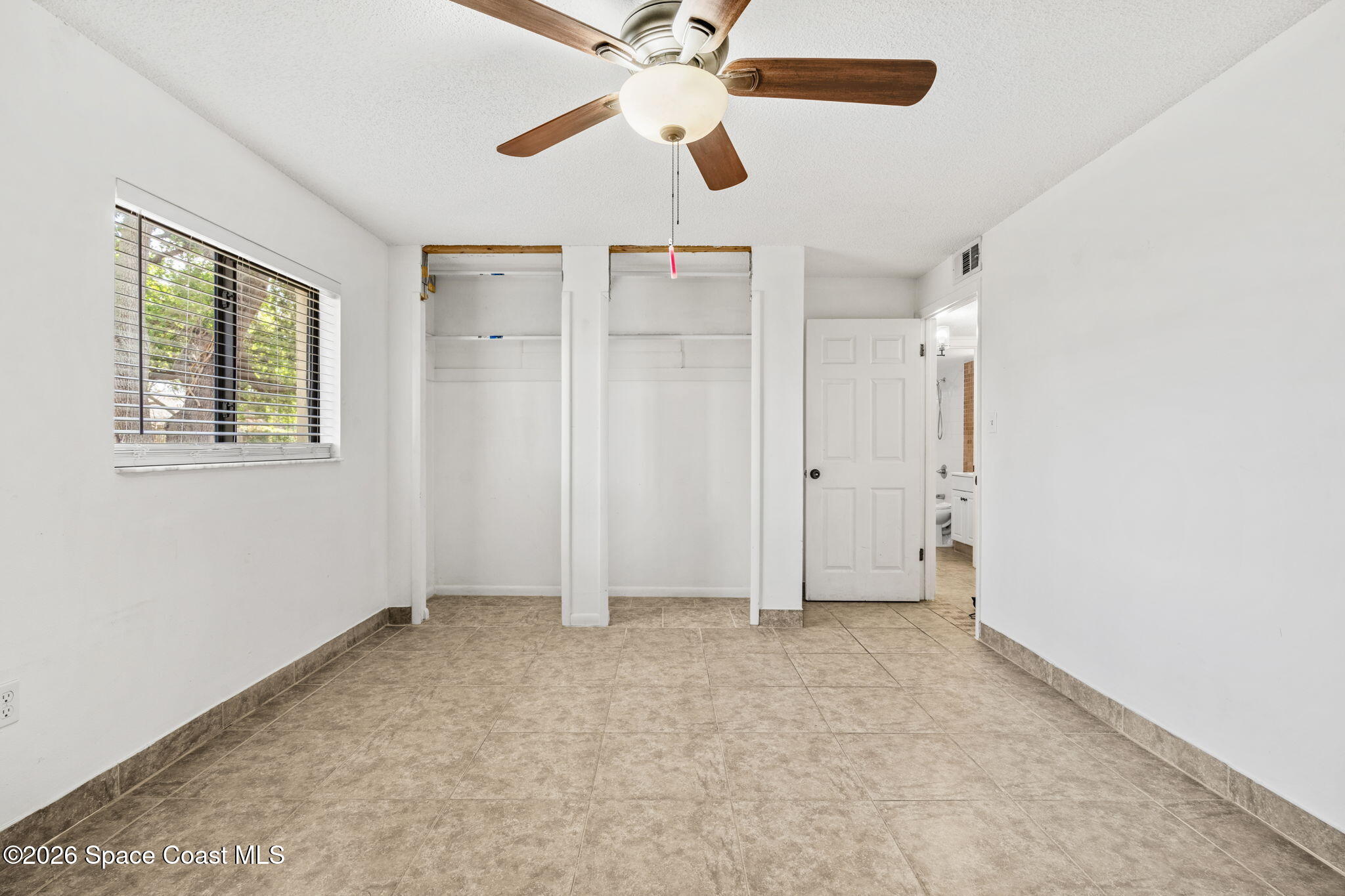 500 Catalina Road, Unit 402 Cocoa Beach, FL 32931 - Photo 14 of 34 a view of an empty room with a window