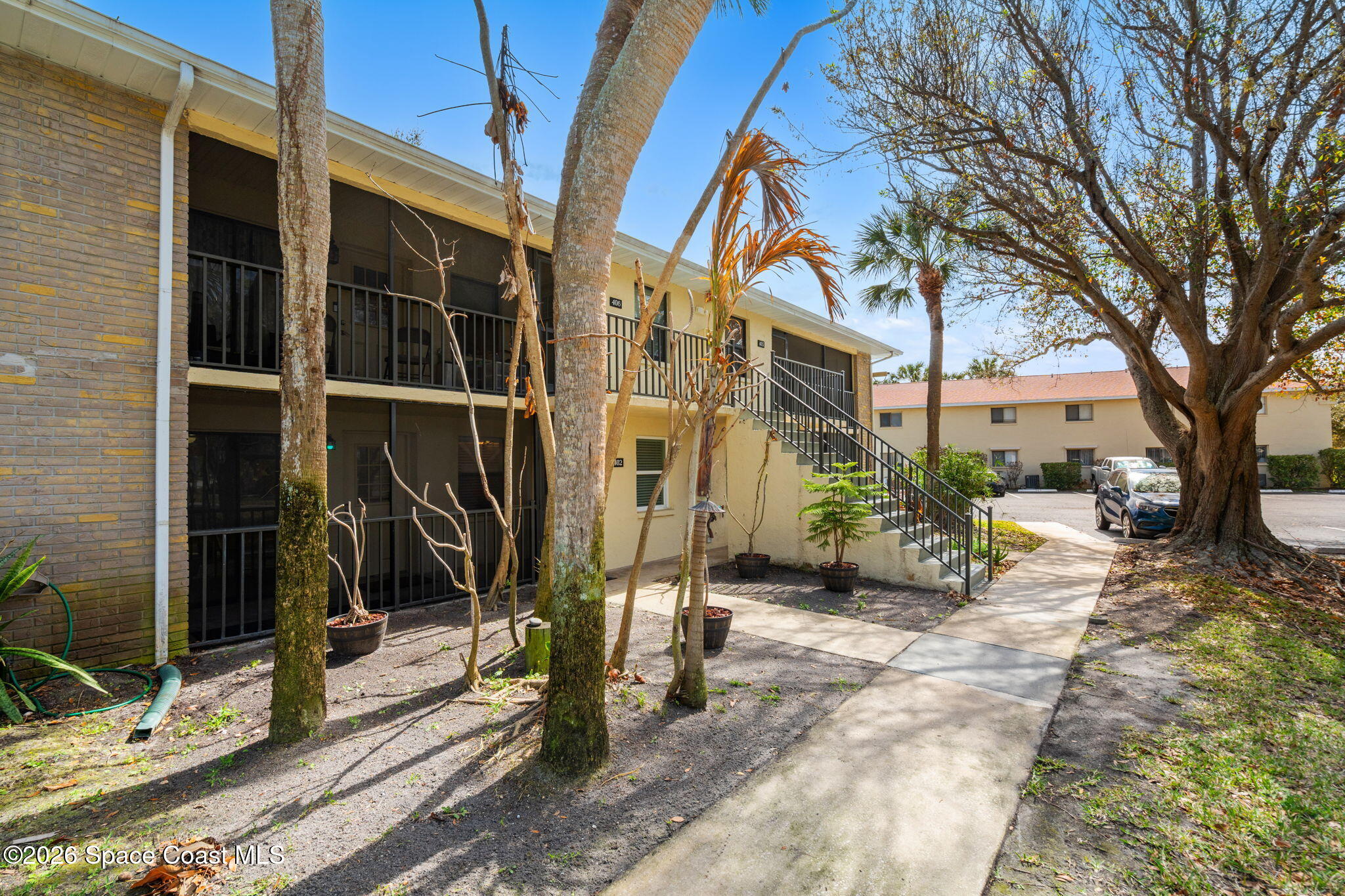 500 Catalina Road, Unit 402 Cocoa Beach, FL 32931 - Photo 34 of 34 a view of a house with backyard