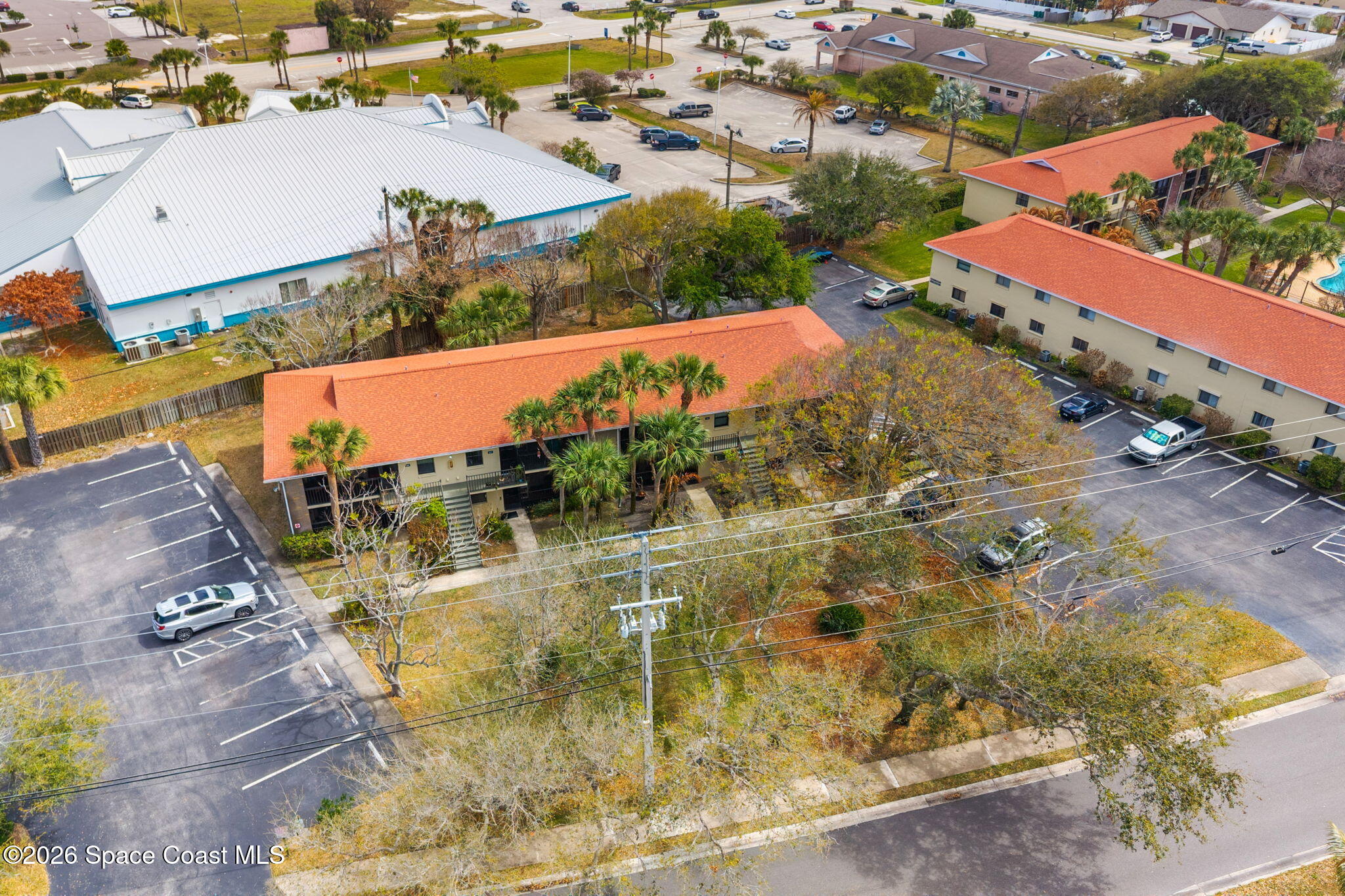 500 Catalina Road, Unit 402 Cocoa Beach, FL 32931 - Photo 26 of 34 an aerial view of residential houses with outdoor space