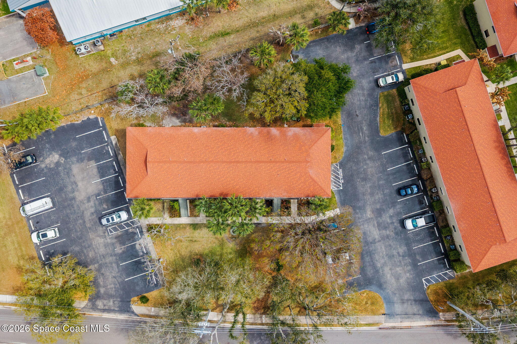 500 Catalina Road, Unit 402 Cocoa Beach, FL 32931 - Photo 27 of 34 an aerial view of a residential houses with outdoor space