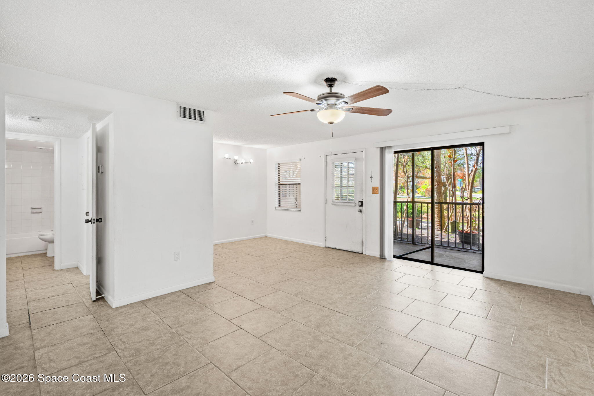 500 Catalina Road, Unit 402 Cocoa Beach, FL 32931 - Photo 2 of 34 a view of an empty room with a window