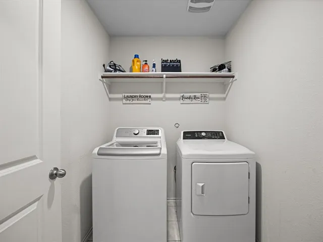 a bedroom with bed and a chandelier