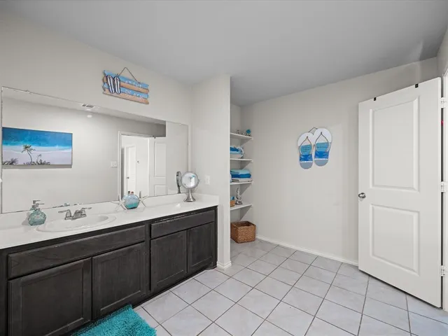 a room with a sink and a mirror