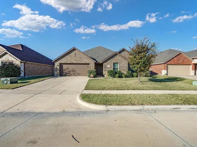 a view of garage and yard