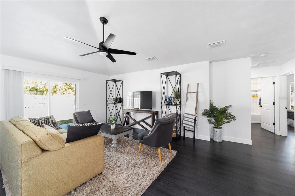 16668 Northwest 191st Way High Springs, FL 32643 - Photo 17 of 38 a living room with furniture and wooden floor