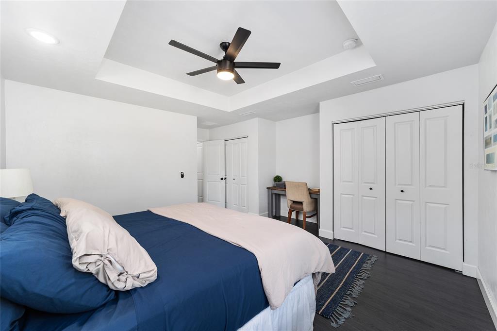 16668 Northwest 191st Way High Springs, FL 32643 - Photo 19 of 38 a bedroom with a bed and a chandelier