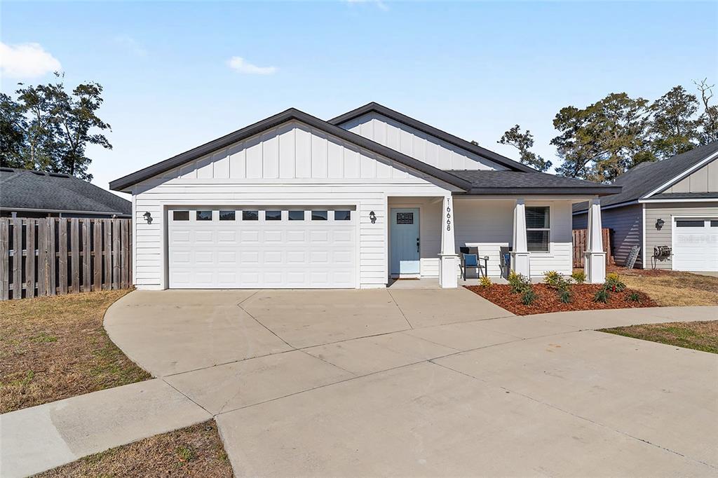 16668 Northwest 191st Way High Springs, FL 32643 - Photo 3 of 38 a view of house with outdoor space and tree in the background