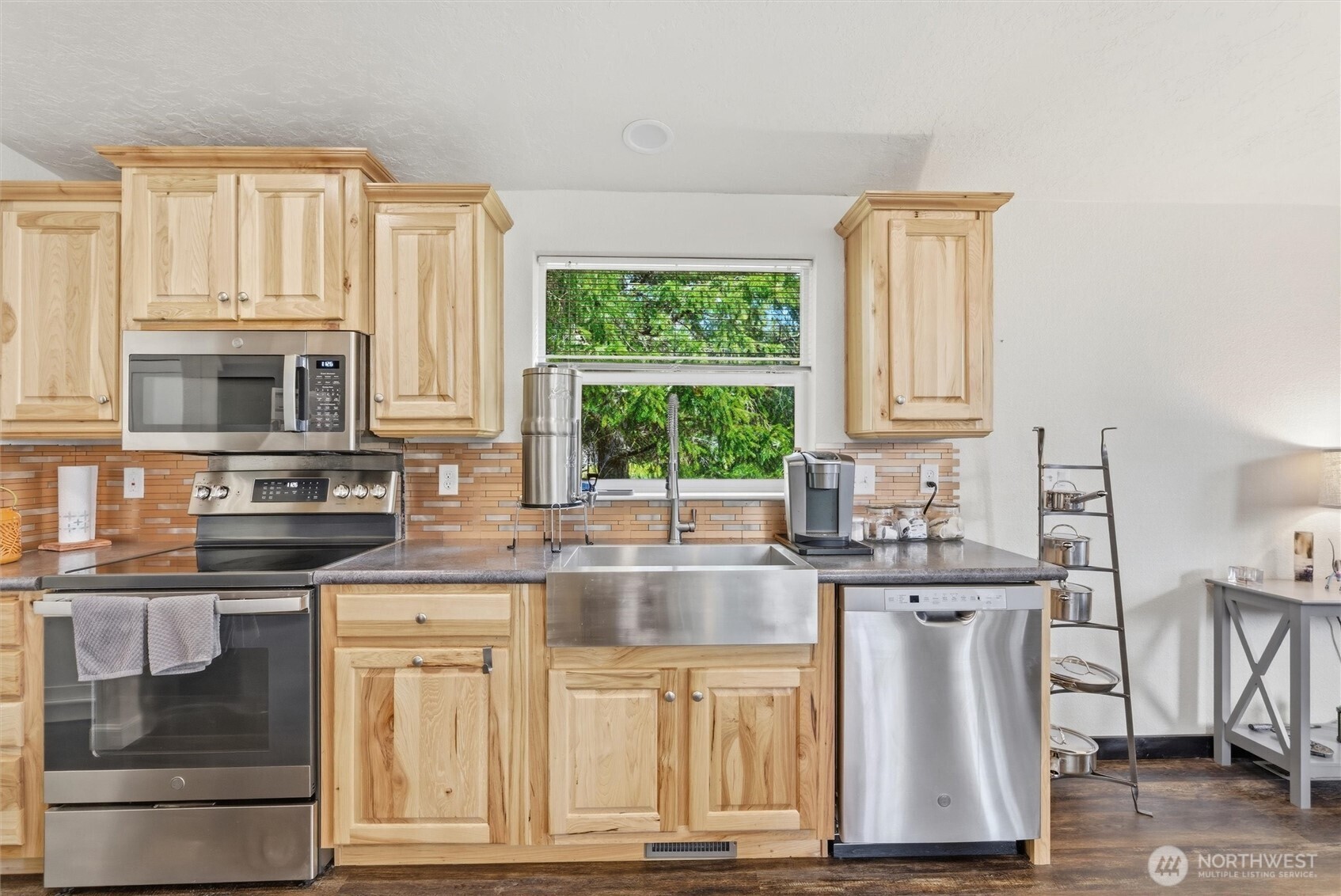 470 Sunshine Drive Sequim, WA 98382 - Photo 15 of 30 a kitchen with stainless steel appliances granite countertop a stove a sink and a microwave