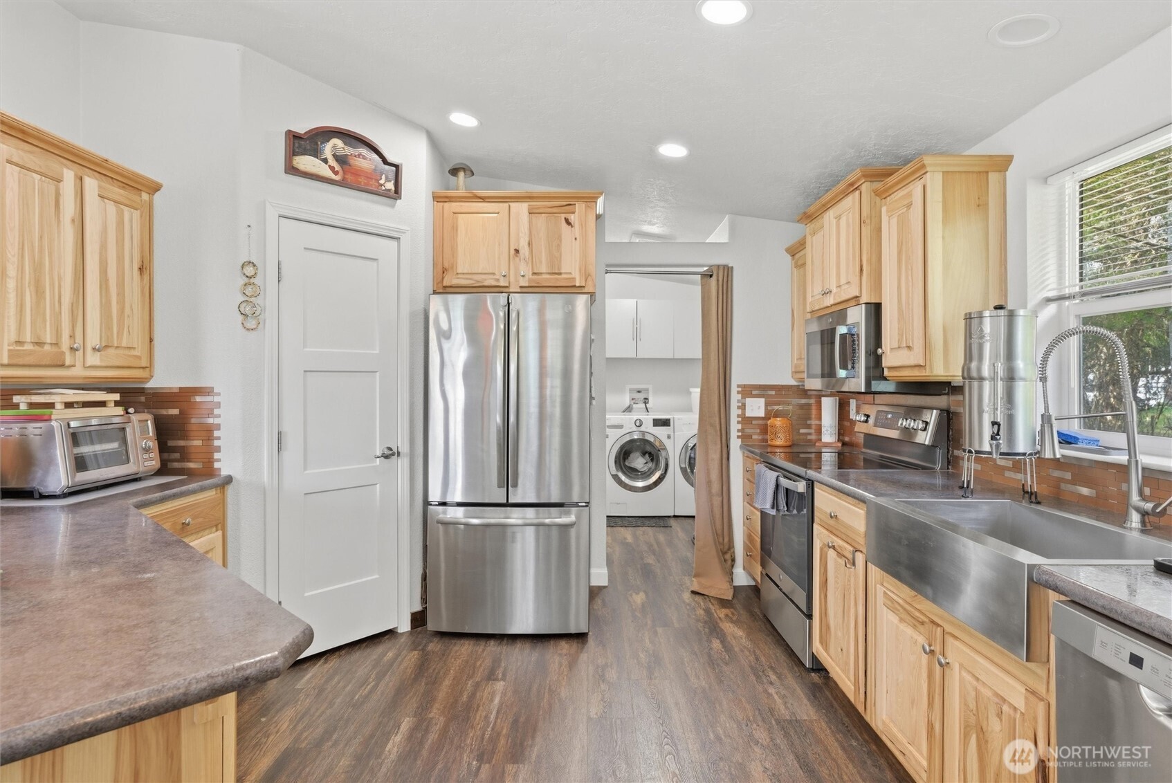 470 Sunshine Drive Sequim, WA 98382 - Photo 16 of 30 a kitchen with stainless steel appliances granite countertop a refrigerator and a sink