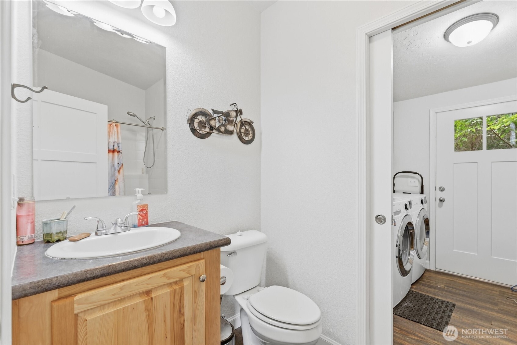 470 Sunshine Drive Sequim, WA 98382 - Photo 18 of 30 a bathroom with a granite countertop sink toilet and shower a mirror
