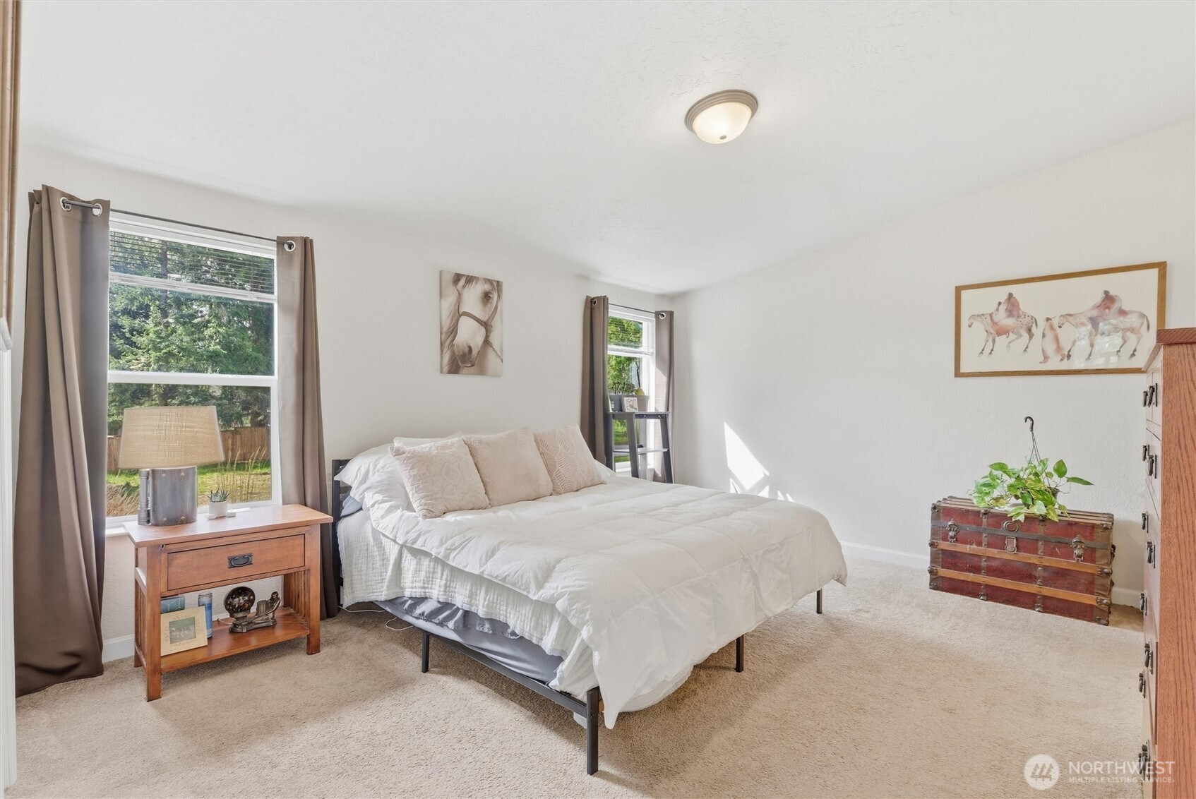 470 Sunshine Drive Sequim, WA 98382 - Photo 20 of 30 a bedroom with a bed table and a window