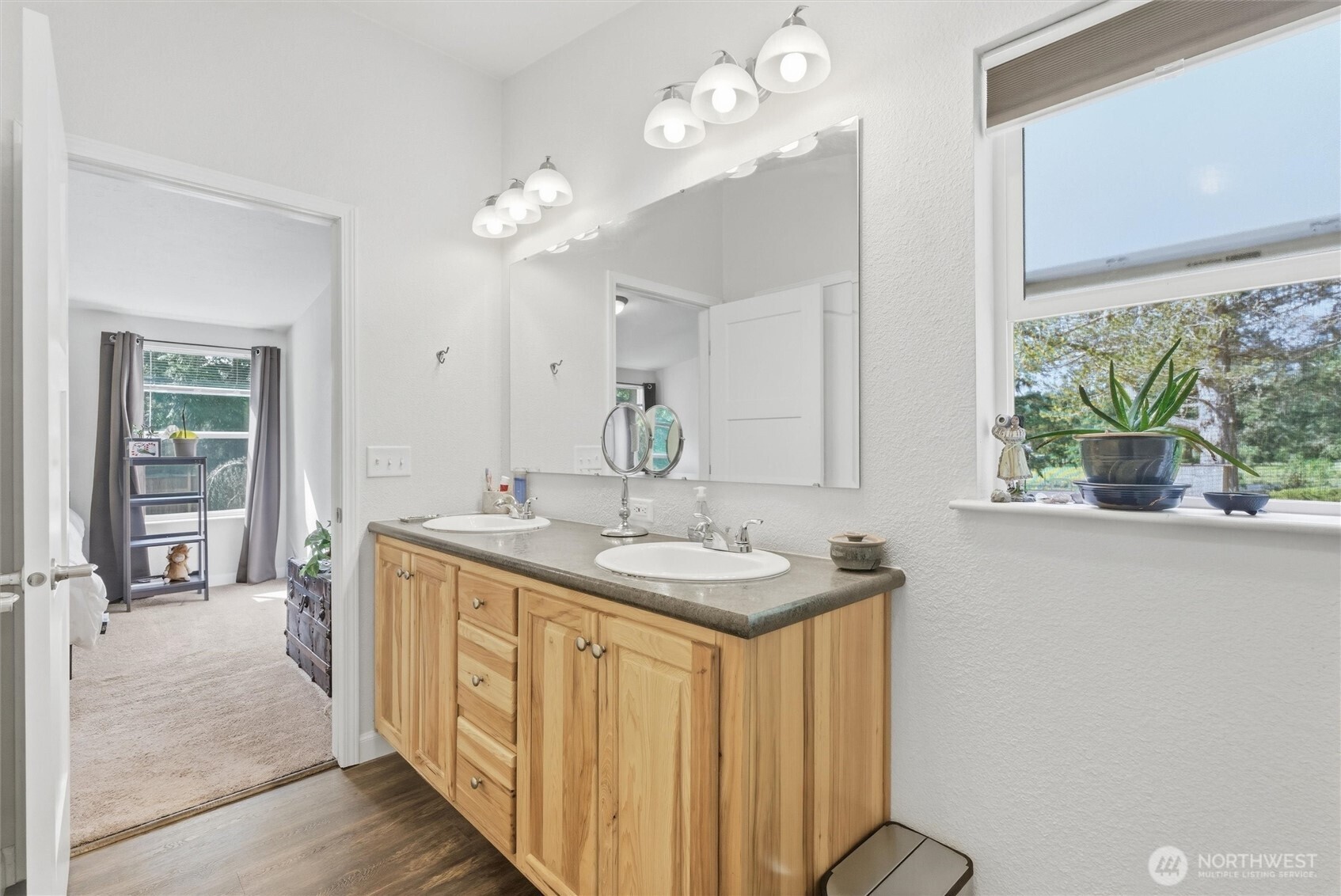 470 Sunshine Drive Sequim, WA 98382 - Photo 22 of 30 a bathroom with a granite countertop sink a large mirror and a window