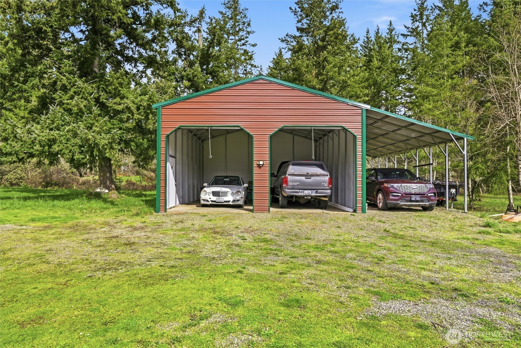 470 Sunshine Drive Sequim, WA 98382 - Photo 24 of 30 a front view of a house with a garden and trees