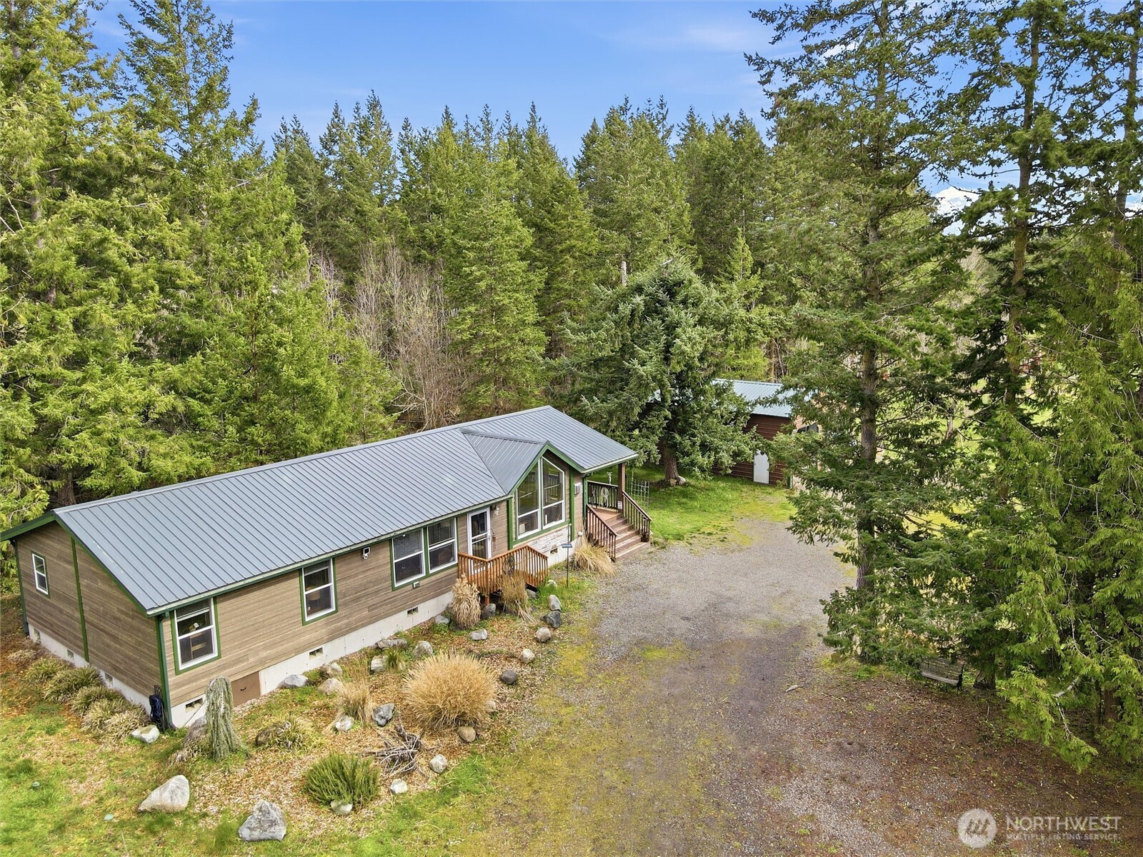 470 Sunshine Drive Sequim, WA 98382 - Photo 25 of 30 a view of a backyard with plants and a yard
